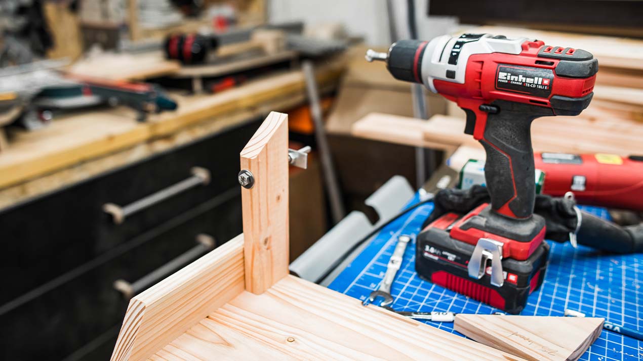 cordless screwdrivers is standing on the workbench