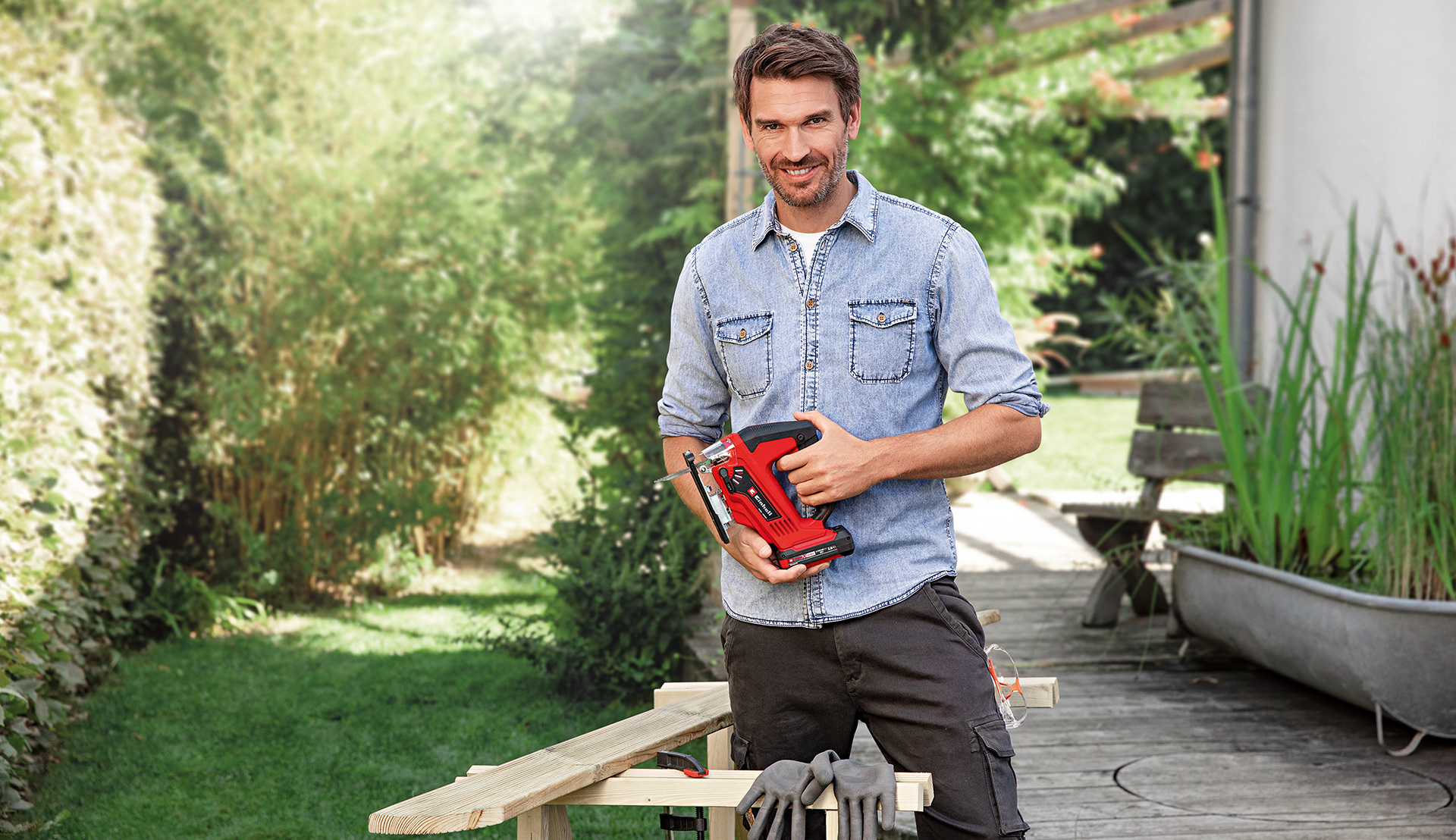 man with cordless jigsaw